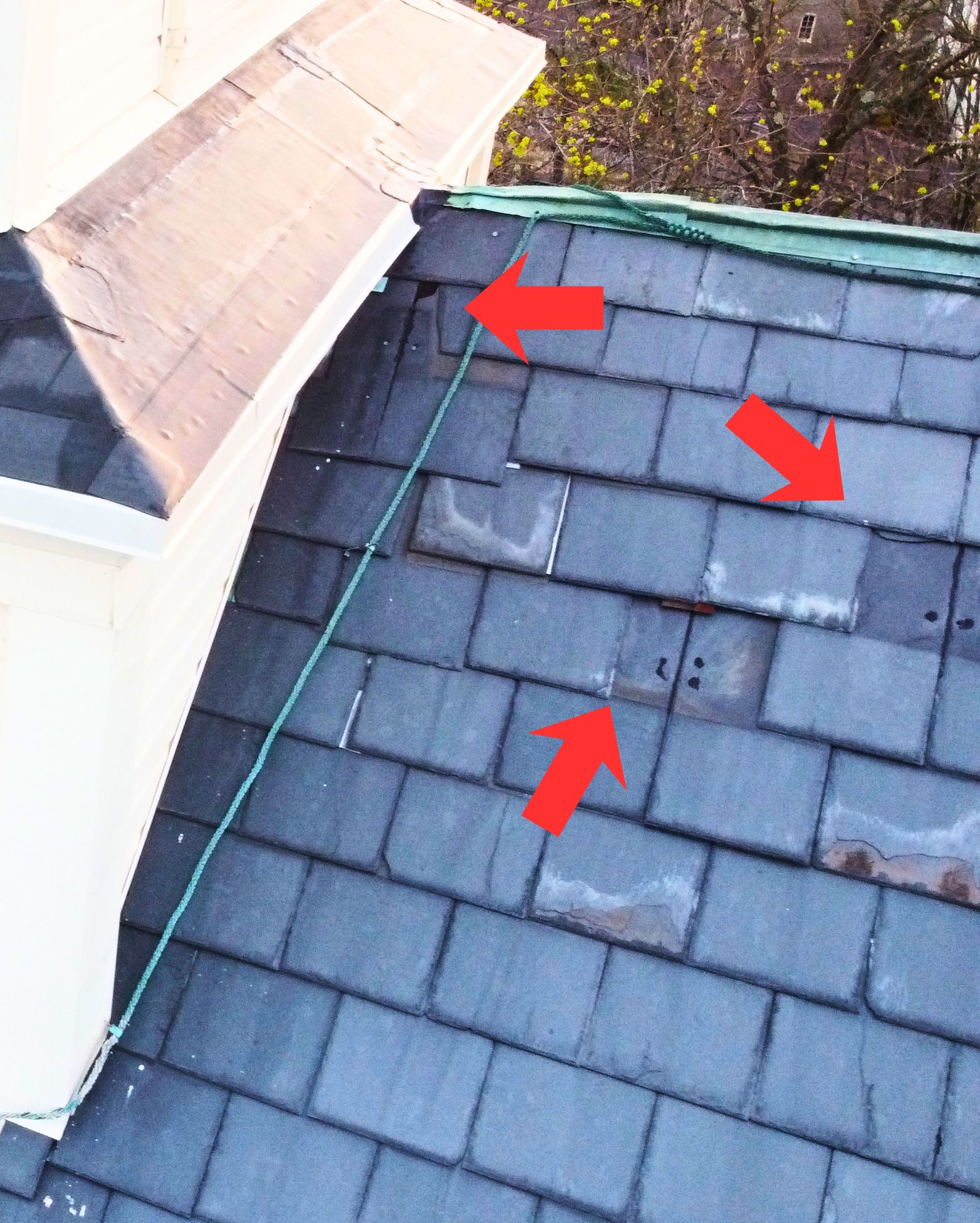 Drone roofing inspection showing slate tile damage with annotated markers